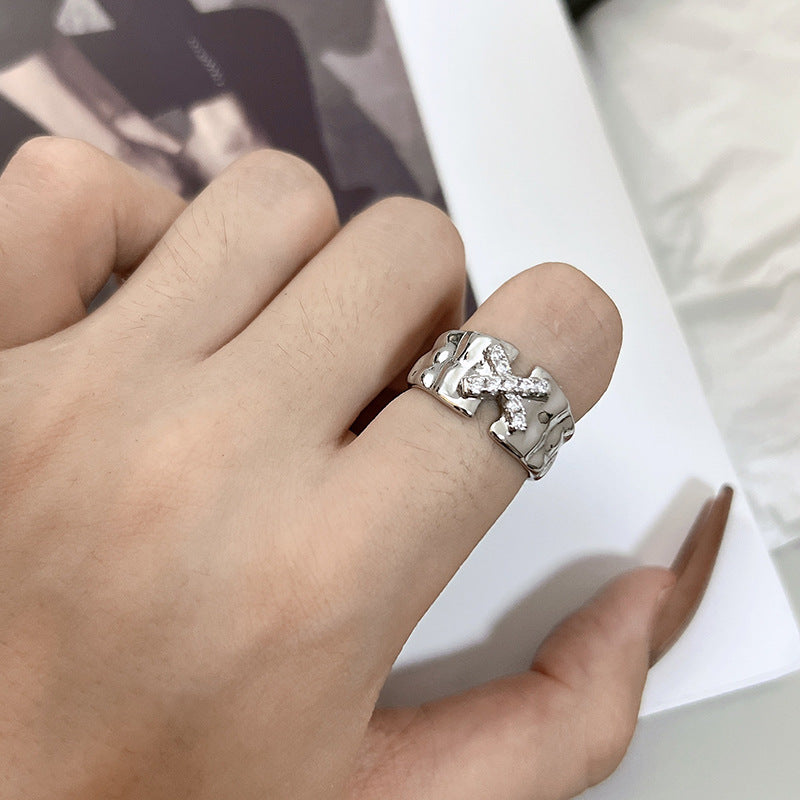 Ring with the letter X zircon