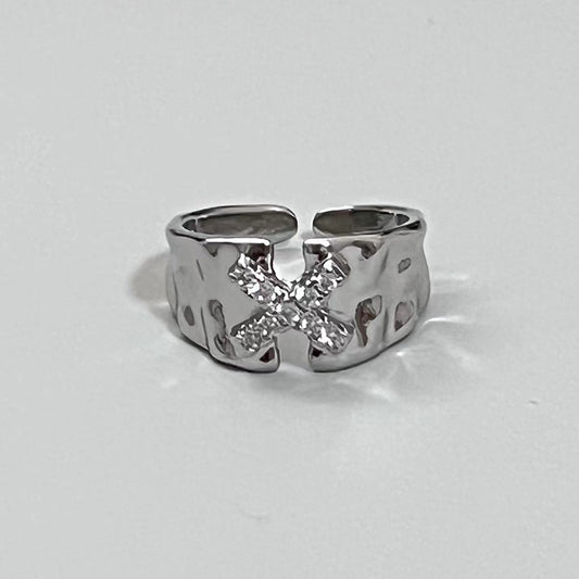 Ring with the letter X zircon